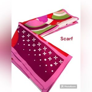 Hinge small bright colored scarf. Add a spark of color to any outfit.